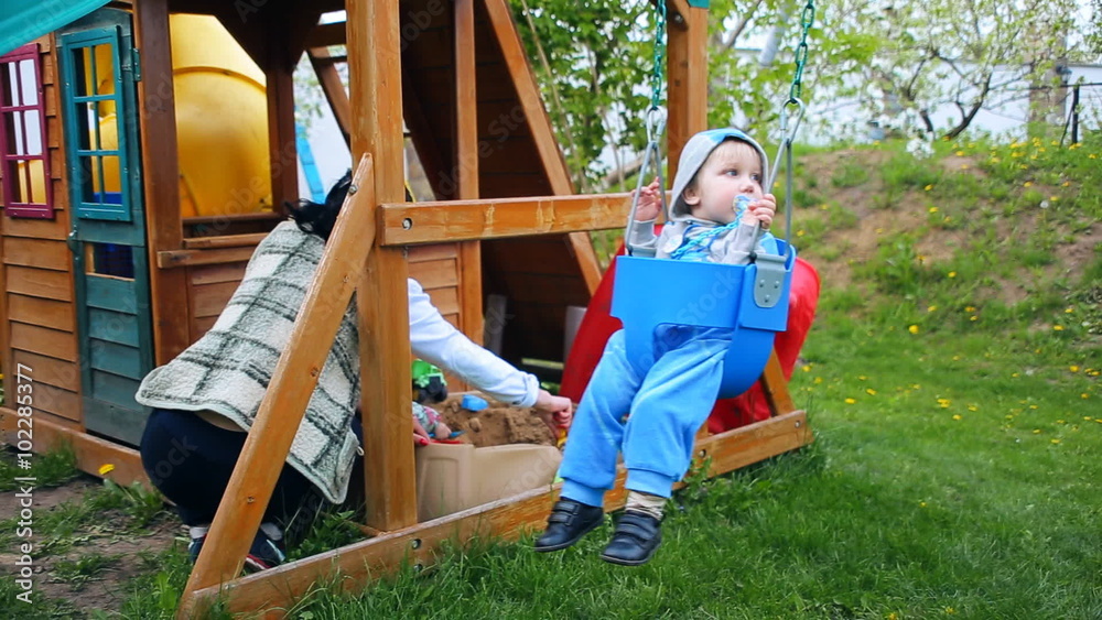 children's playground, kid baby child boy toddler on a swing teeter children's playground, kid baby child boy toddler on a swing teeter