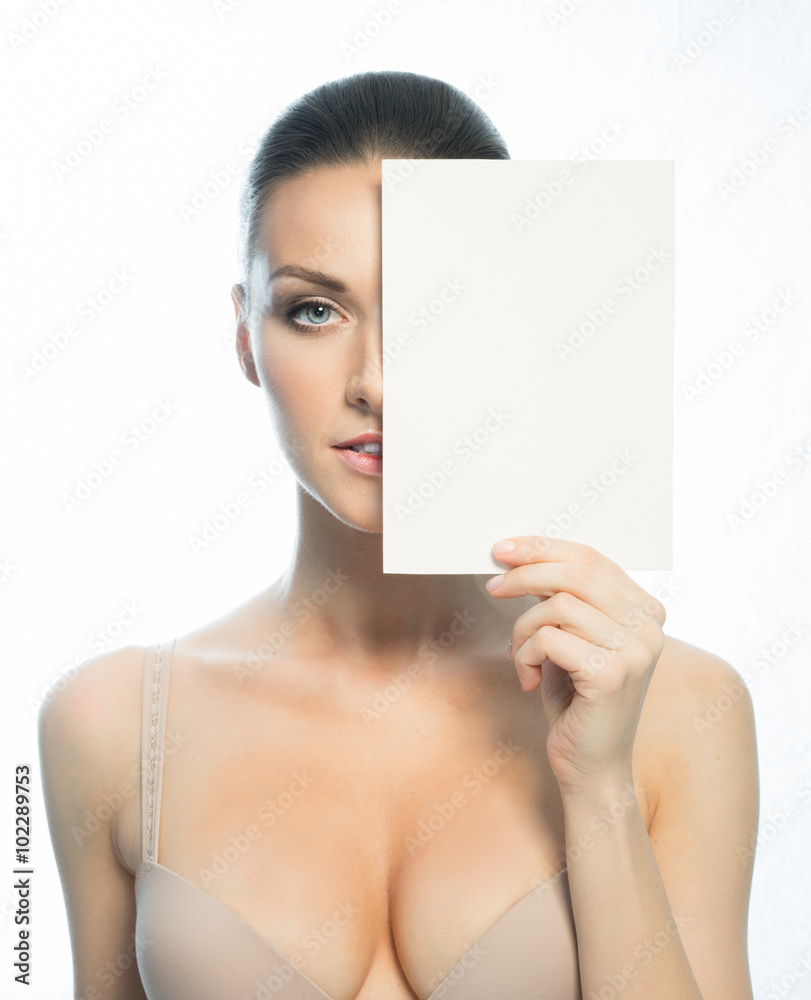 The girl with a clean face shows the blank form for the inscription The girl with a clean face shows the blank form for the inscription
