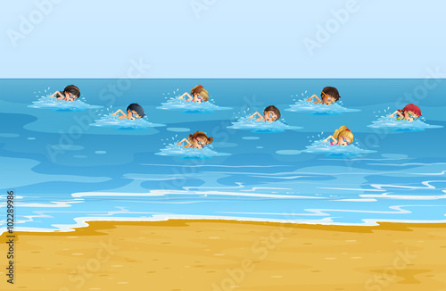 Boys and girls swimming in the ocean