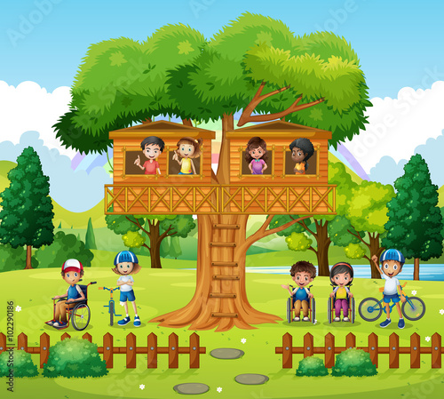 Children playing at the treehouse in the park