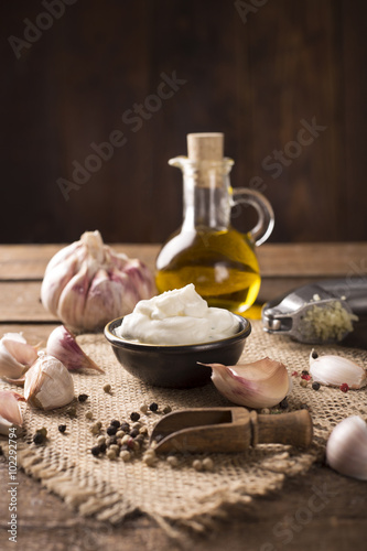 Obraz na plátne Aioli dip on wooden background