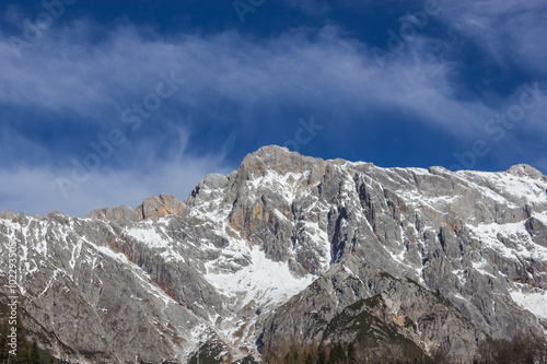 Panoramic view of idyllic winter wonderland with mountain tops i