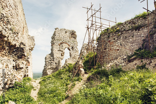 Plavecky castle in Slovak republic, ruins with scaffolding photo