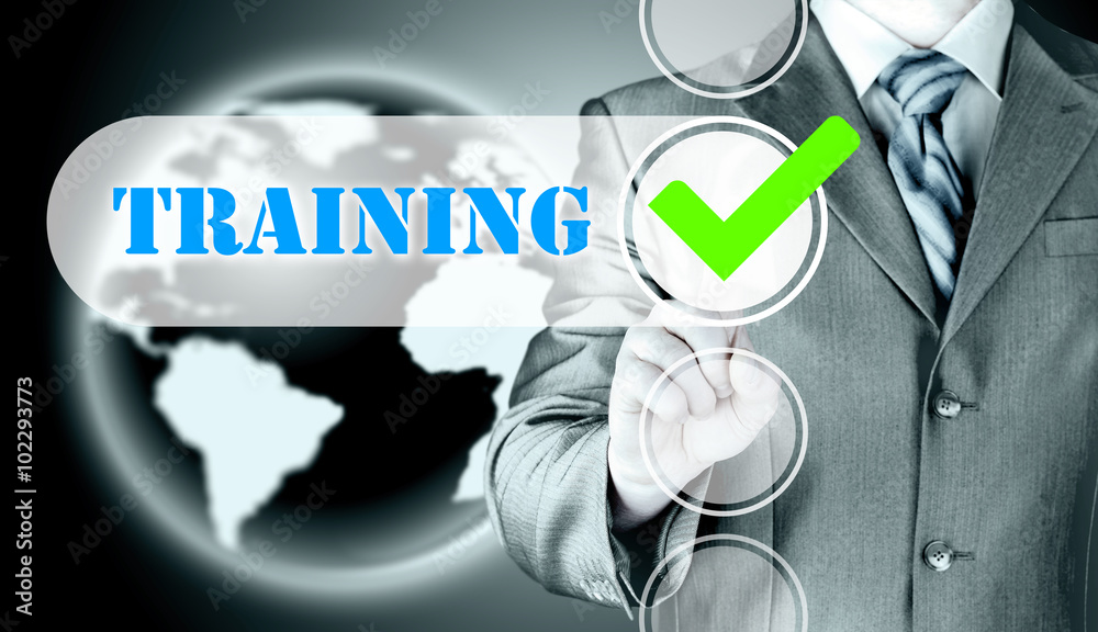Businessman pressing touch screen interface training checkbox Businessman pressing touch screen interface training checkbox
