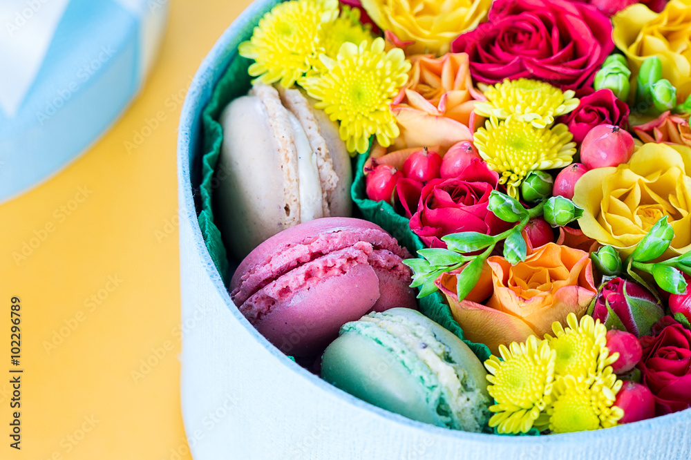 Gift Box of Colourful Macaron with Flowers on Light Orange Background, Natural light, Bloom Box, Flower Box, Close-up, Horizontal, Free Space for Text