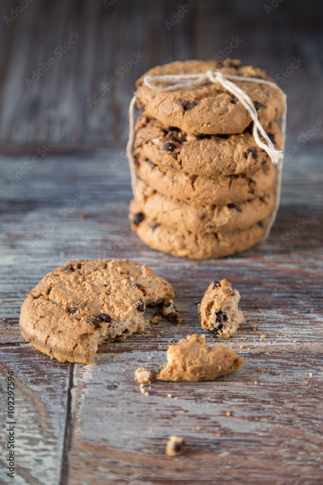 Tasty cookies and glass of milk on rustic wooden background Tasty cookies and glass of milk on rustic wooden background