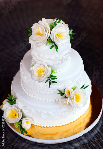 Naked cake. Wedding rustic cake with flowers.