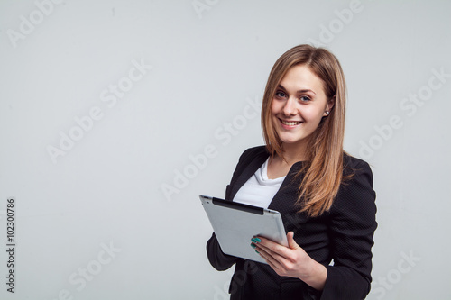 Smiling Businesswoman Holding Digital Tablet. Isolated On White