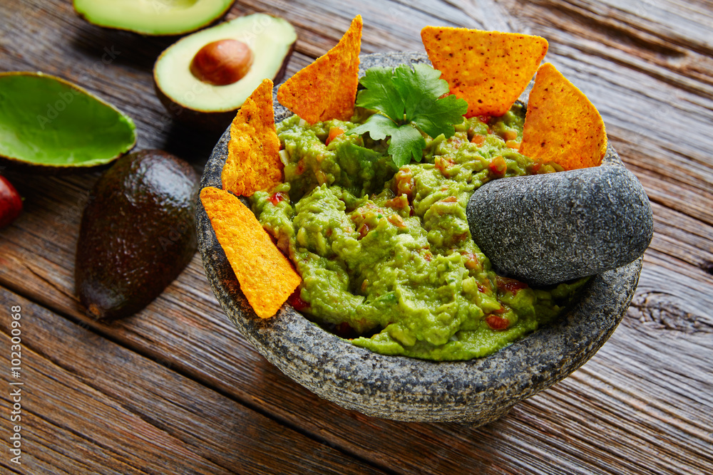 Guacamole with nachos in Mexican molcajete Guacamole with nachos in Mexican molcajete