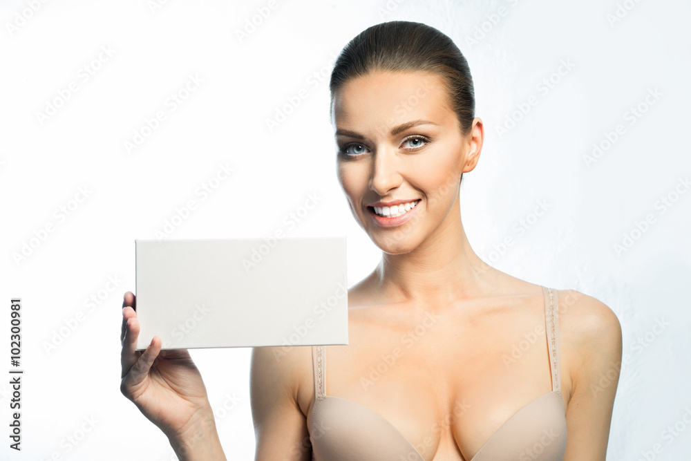 The girl with a beautiful smile, healthy teeth, large breasts, and promotional card The girl with a beautiful smile, healthy teeth, large breasts, and promotional card