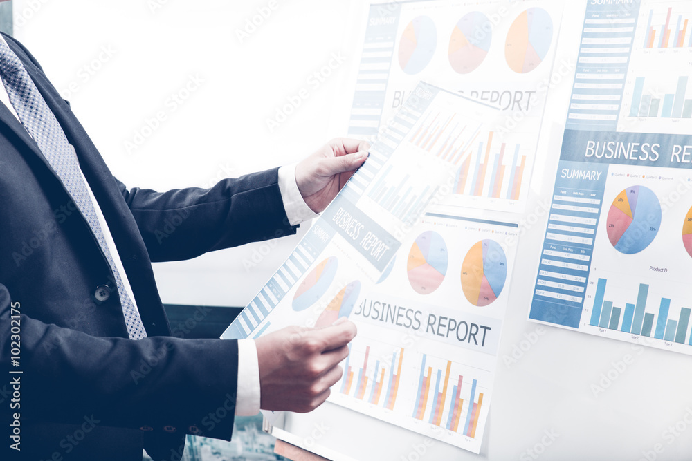 Business people discussing the charts and graphs showing the res Business people discussing the charts and graphs showing the res