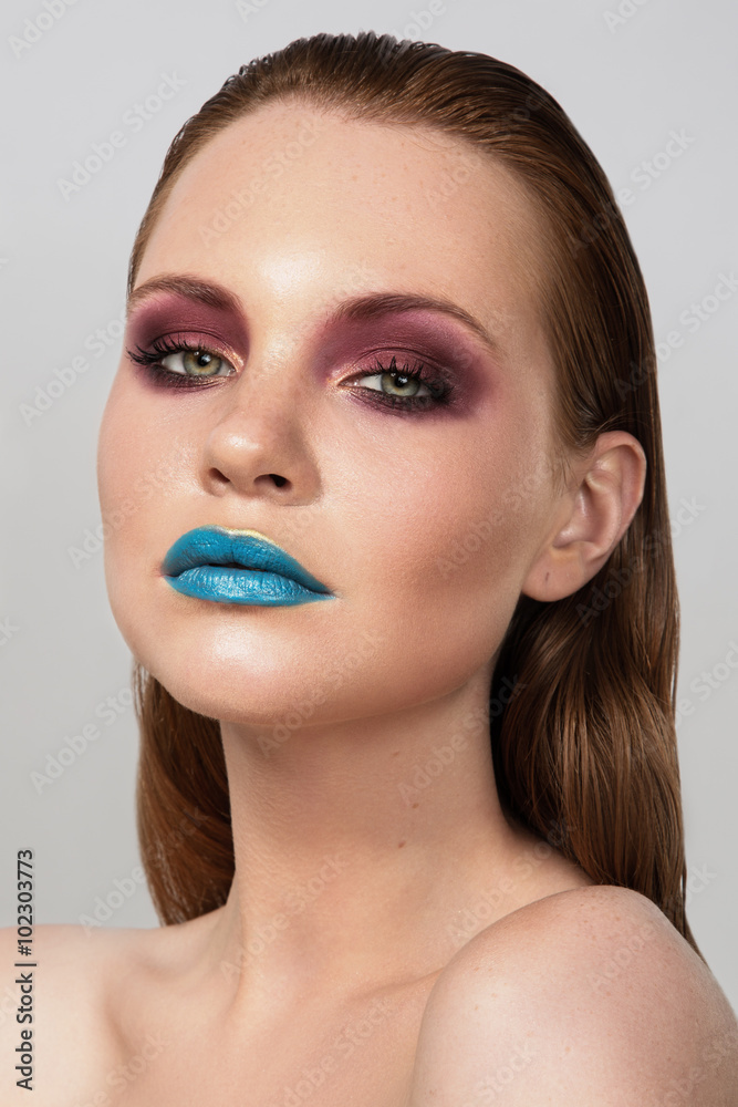 Beauty Woman Portrait.  Long Red Hair and creative make up art.