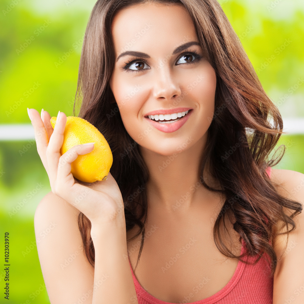 Happy smiling young lovely woman with limon, outdoor Happy smiling young lovely woman with limon, outdoor