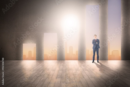 Composite image of happy businessman looking at camera 