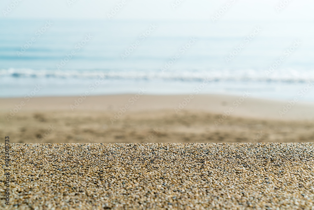 Coping of stone wall with sea and beach blur in background in Prachuap Khiri Khan province, Thailand