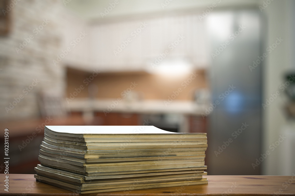 stack of old magazines on wooden table stack of old magazines on wooden table