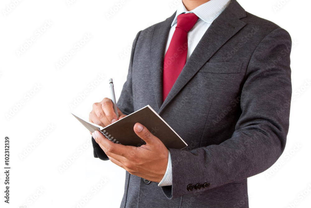Businessman write planning on notepad with pen isolated on white background Businessman write planning on notepad with pen isolated on white background