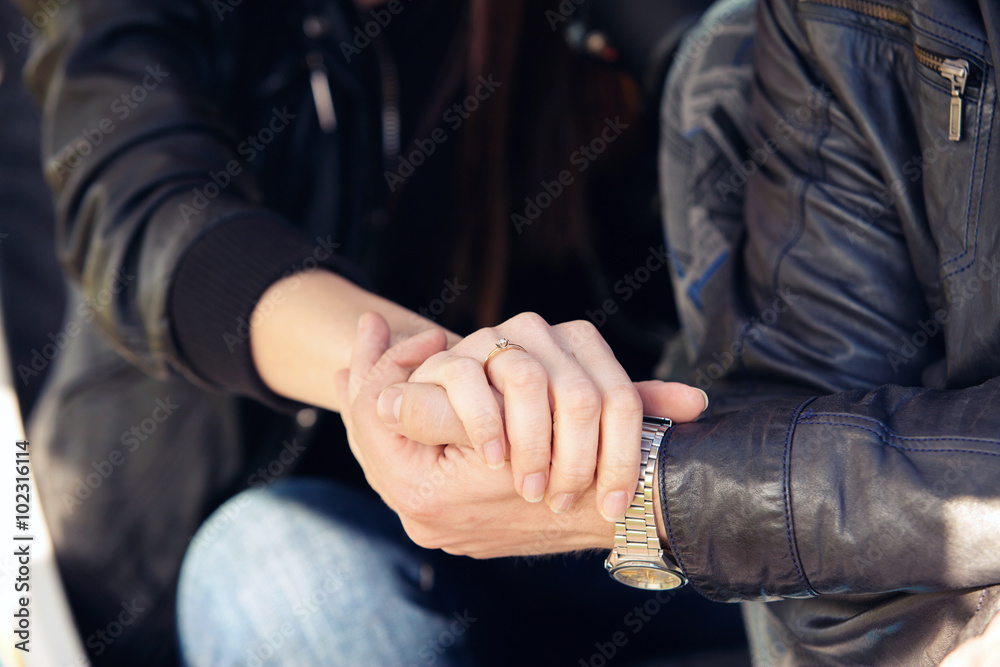 man holds a hand of the girl