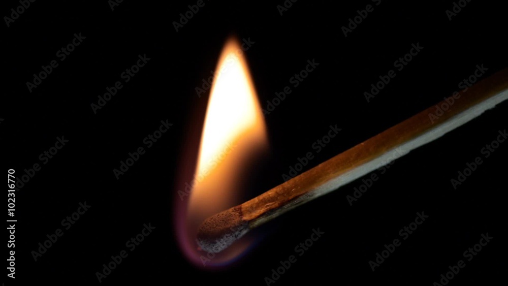 Wooden match burning till the end. Macro shot on black background. Wooden match burning till the end. Macro shot on black background.