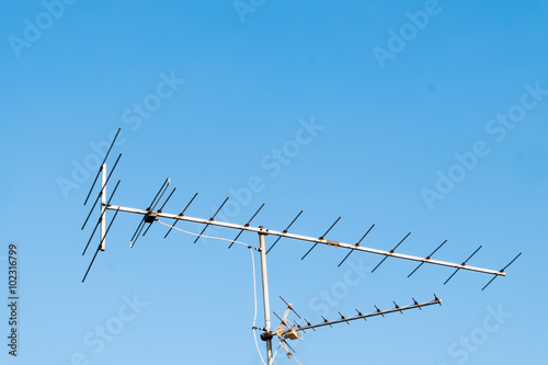 TV antenna with blue sky