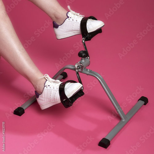 Exercising feet and ankles using an exercise machine