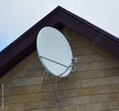 Fotografija Satellite dish on the front of the house
