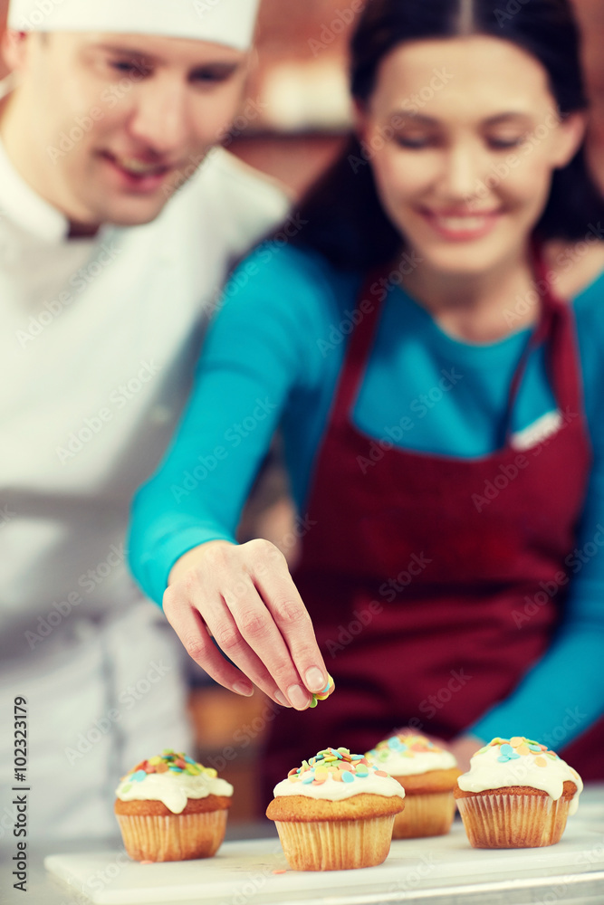 happy woman and chef cook baking in kitchen happy woman and chef cook baking in kitchen