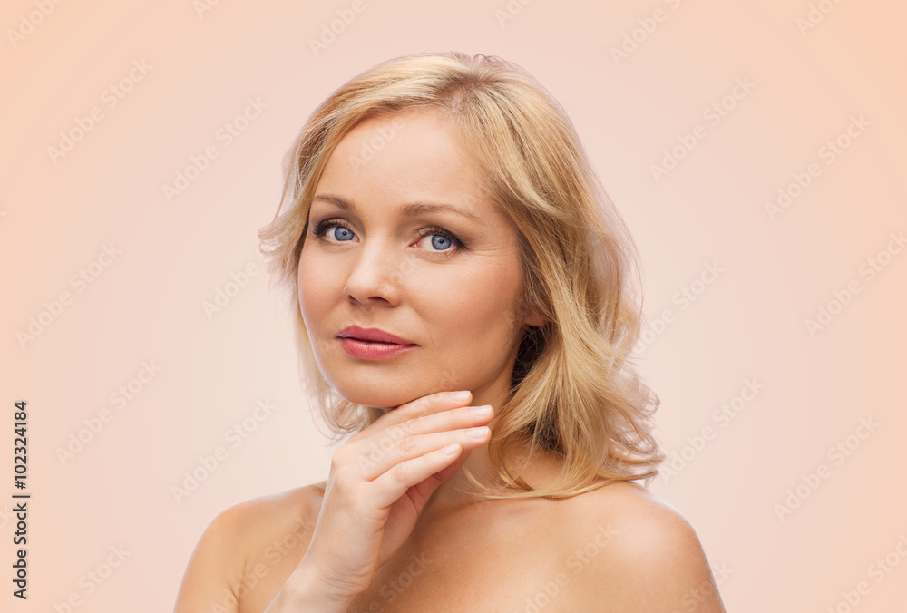 smiling woman with bare shoulders touching face smiling woman with bare shoulders touching face