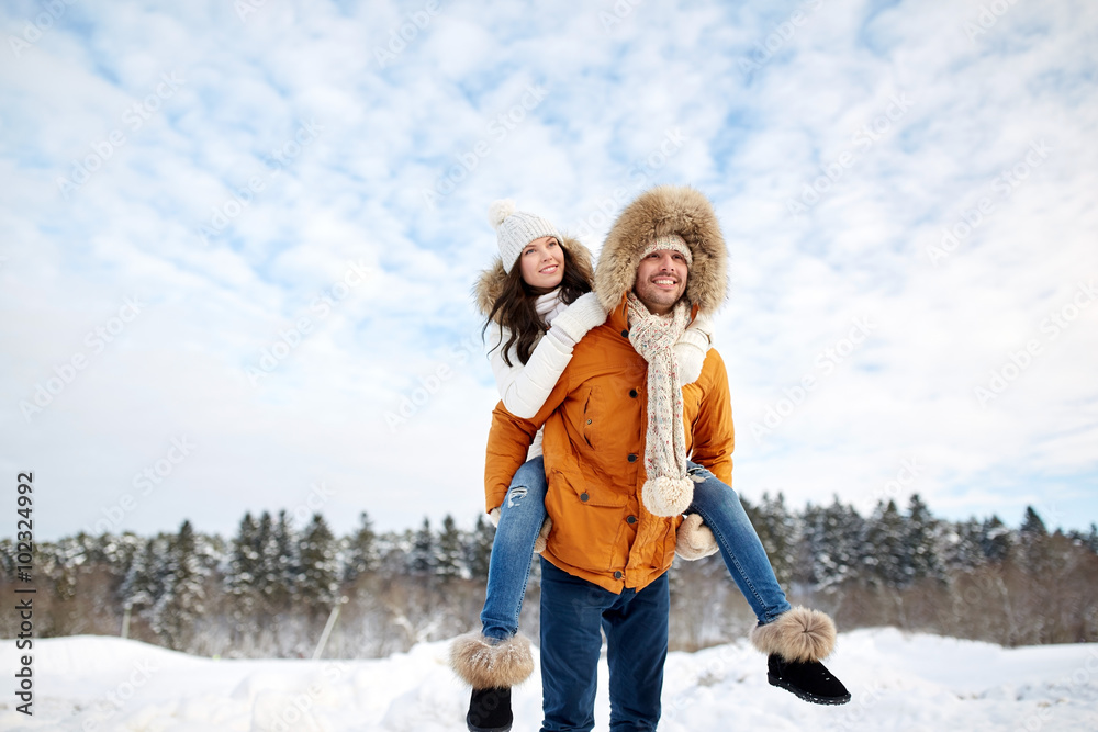 © Syda Productions - happy couple having fun over winter background