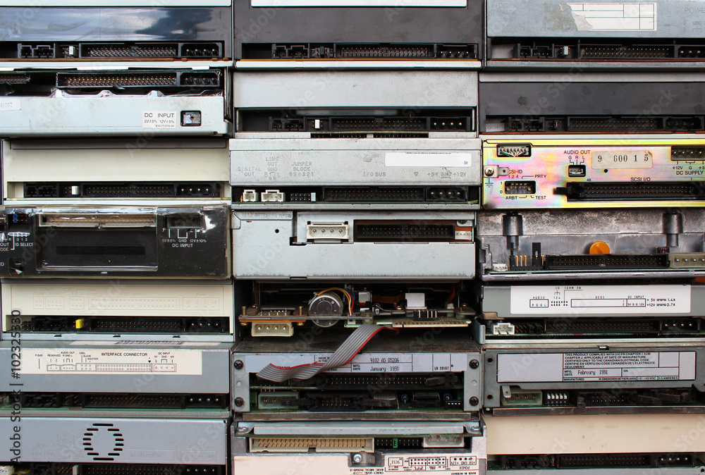 Rear panels of old floppy cd and dvd drives as background Rear panels of old floppy cd and dvd drives as background