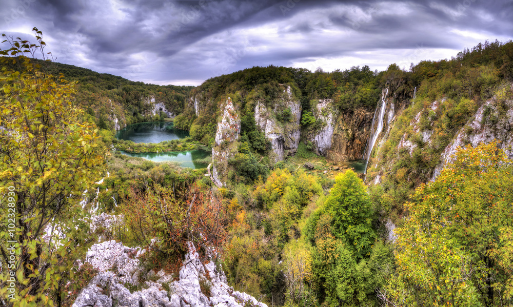 Dark clouds over a beautiful autumn view of Plitvice national park in Croatia, a UNESCO world heritage site Dark clouds over a beautiful autumn view of Plitvice national park in Croatia, a UNESCO world heritage site