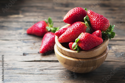 Sweet red strawberry on the wooden table