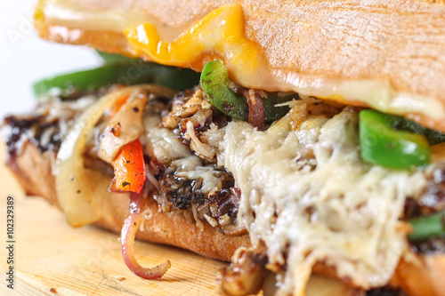 Tasty vegetarian sandwich in a ciabatta on a wodden plate photo