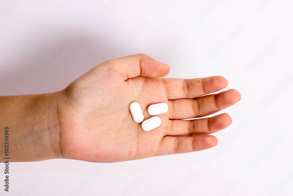 hand holding pills hand holding pills