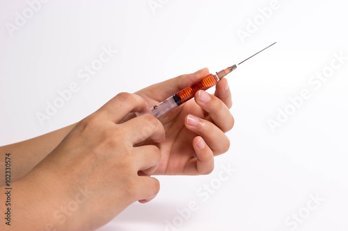 Syringe in hand