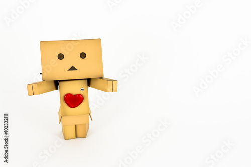 Adorable Danbo character wearing a red heart with outstretched arms. photo