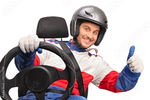 Joyful car racer giving a thumb up