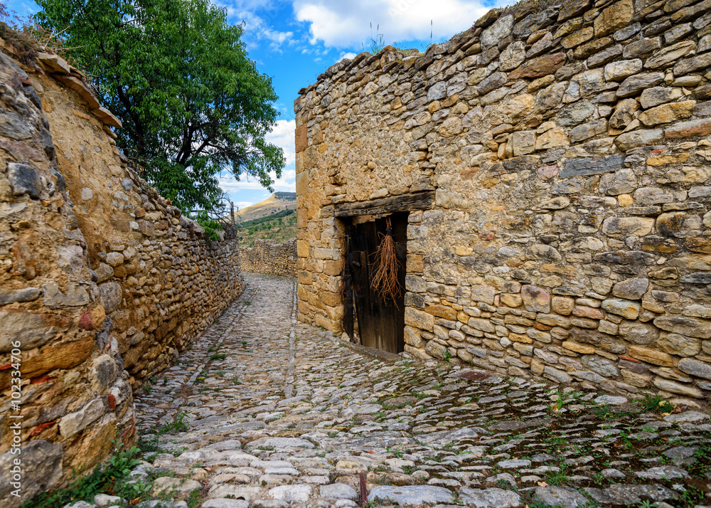 Mirambel medieval street on a summer day, the province of Teruel, Aragon, Spain. Mirambel medieval street on a summer day, the province of Teruel, Aragon, Spain.