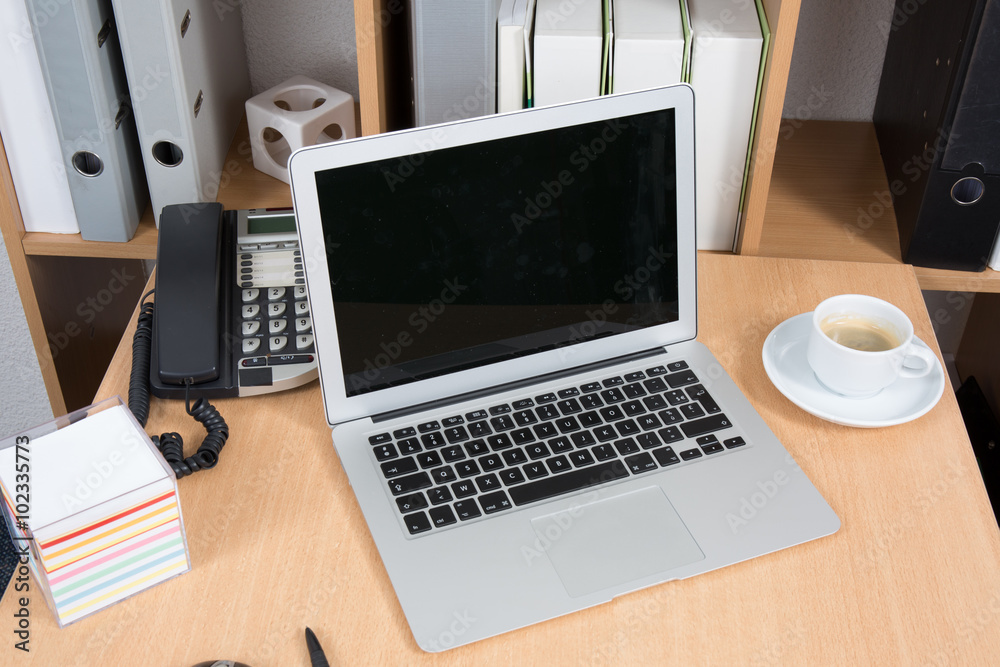 Cup of coffee and laptop on wood floor Cup of coffee and laptop on wood floor
