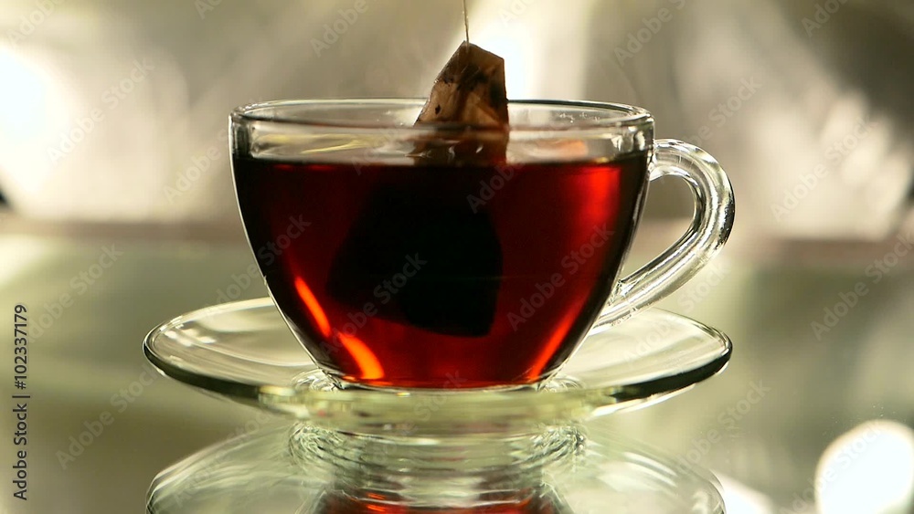 black tea in a bag brewed with boiling water in cup and saucer black tea in a bag brewed with boiling water in cup and saucer