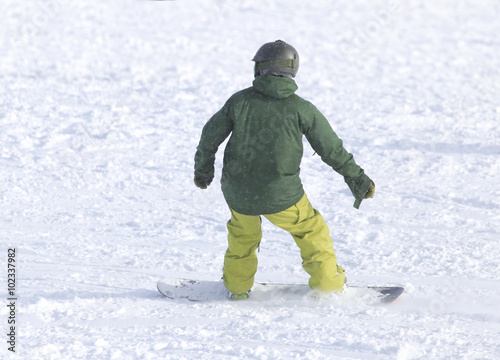 people snowboarding on the snow