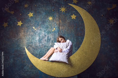 girl sleeping on the moon