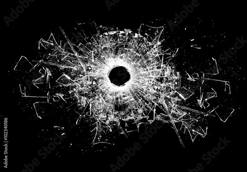 Bullet hole isolated on black photo