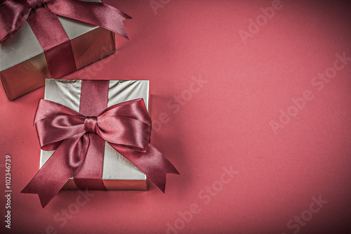 Gift boxes on red background horizontal image holidays concept