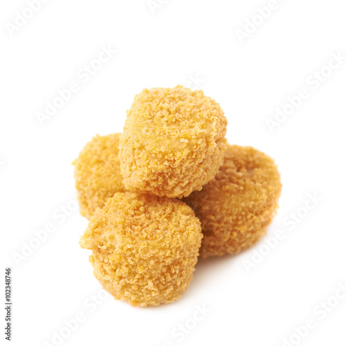 Pile of breaded crab balls isolated