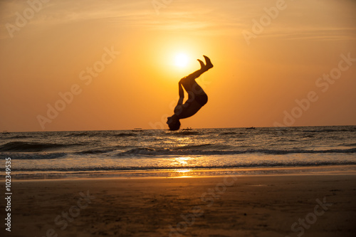 acrobat on the beach
