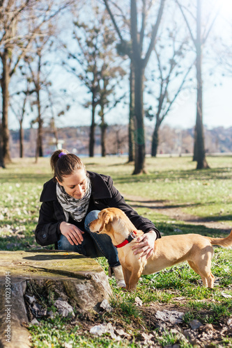 Woman enjoying in the park with a dog © kerkezz