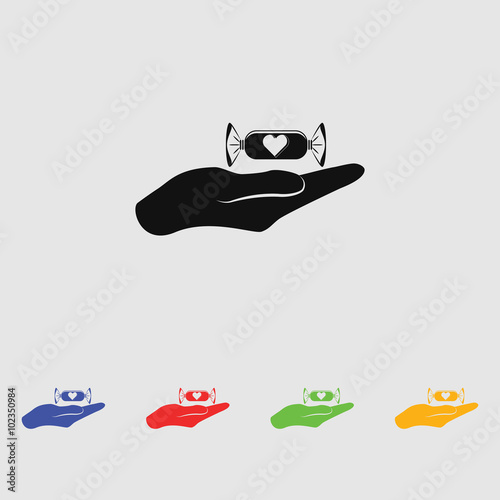 Candy on hand - Valentine's Day vector icon