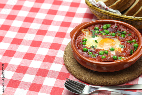 flamenco eggs, huevos a la flamenca, spanish andalusian cuisine photo