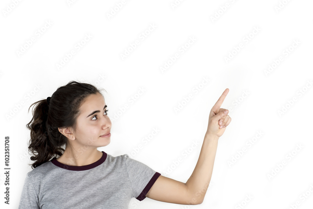 Young girl shows forefinger, attention sign, isolated on white background Young girl shows forefinger, attention sign, isolated on white background